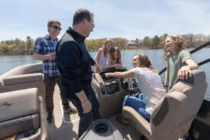 family on a pontoon boat for demo