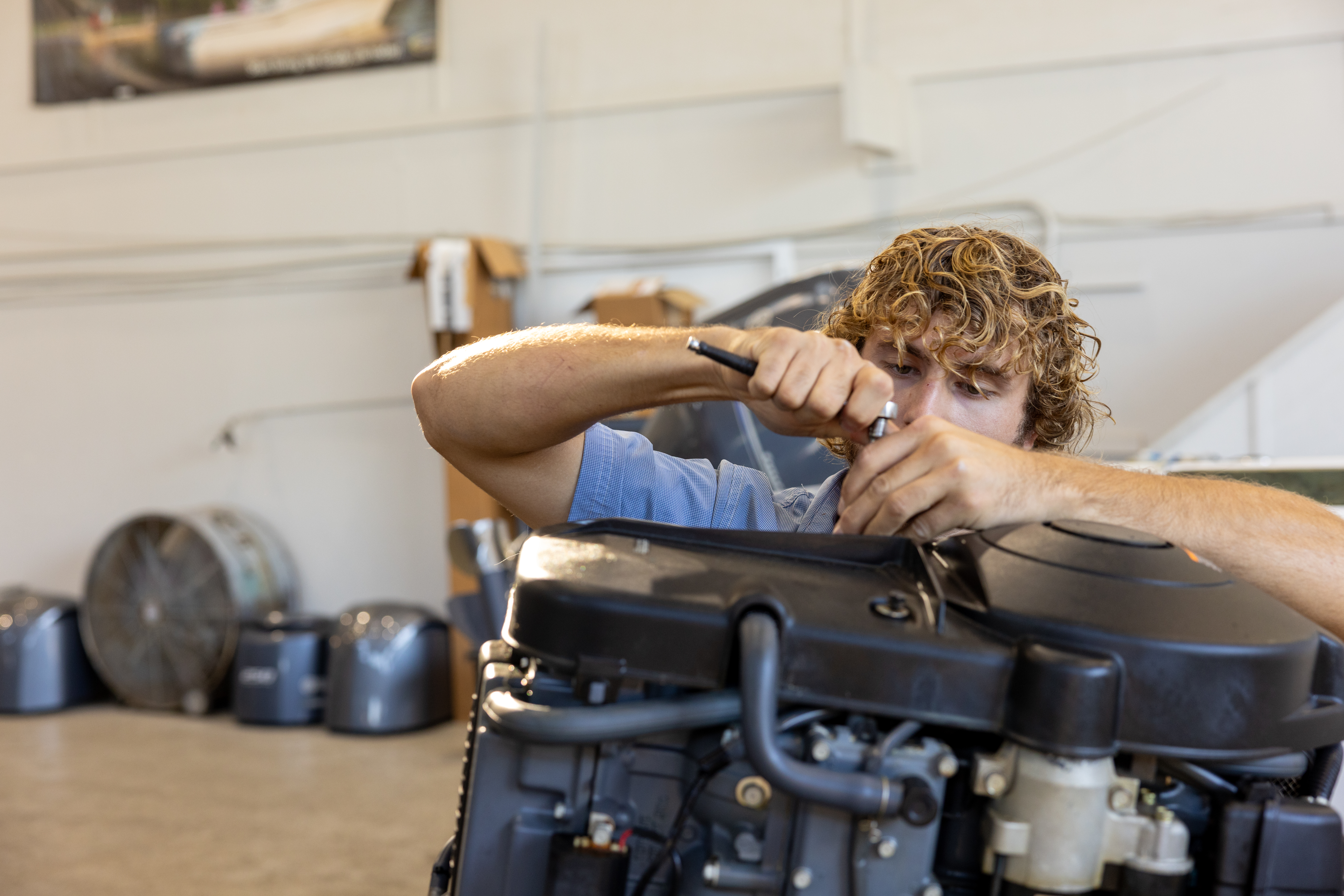 Marine technician working at a service shop
