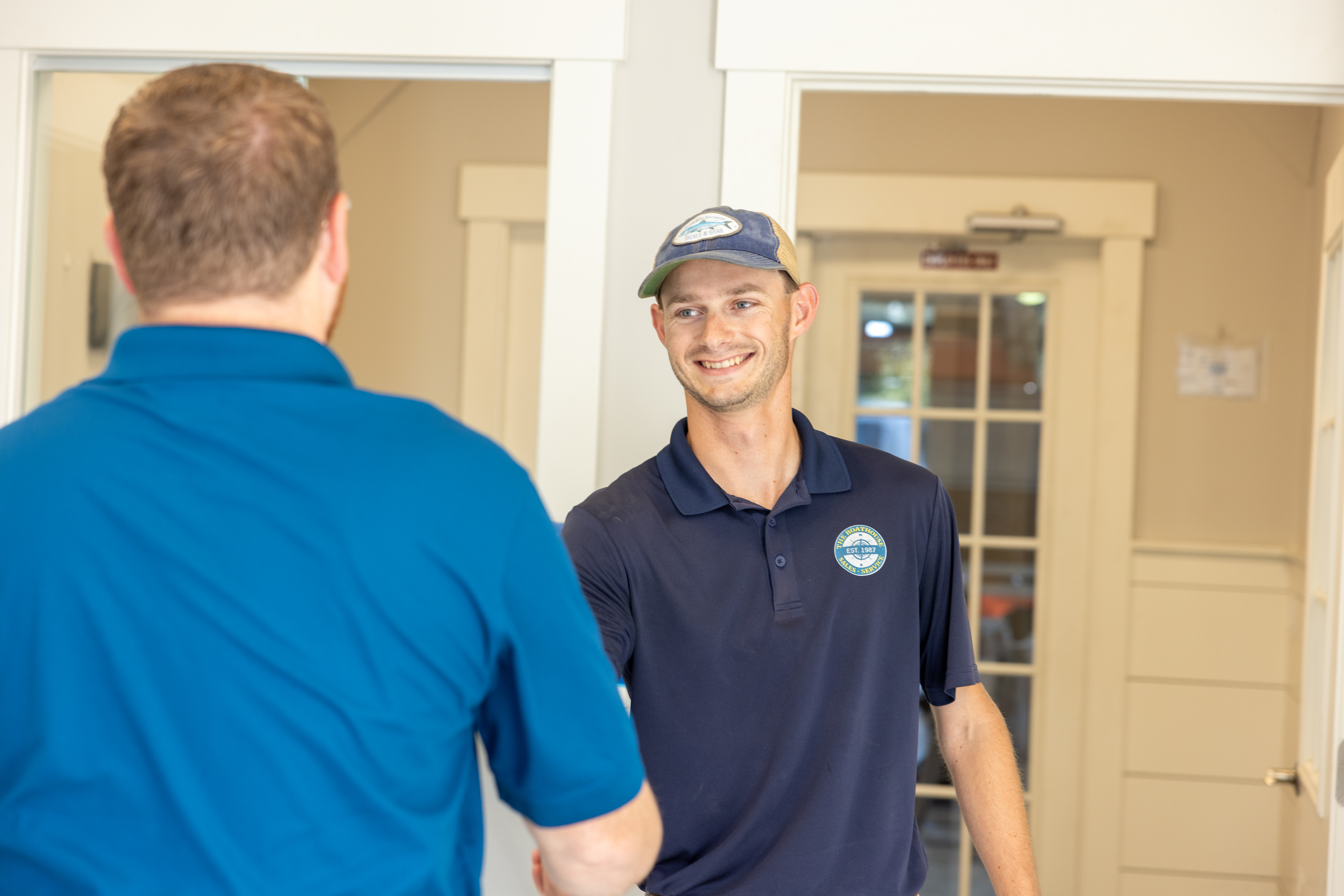 Boat sales person closing a deal with a customer.