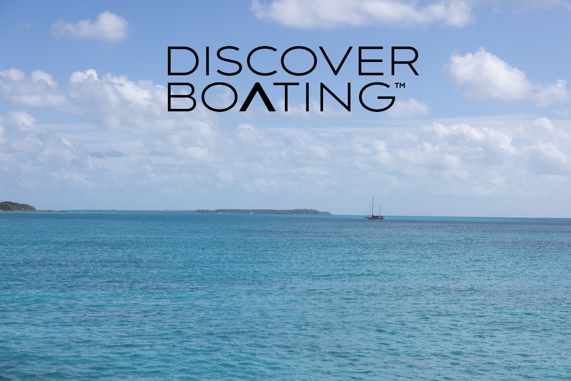 DiscoverBoating black logo overtop an image of distant boat on a tranquil blue sea.
