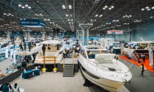 event photo showing boats inside a convention center at boat show