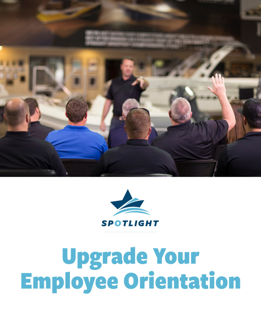 Upgrade your employee orientation with MRAA Spotlight. Banner image featuring a training session in a marine dealership, with an instructor addressing employees, one raising a hand to ask a question.