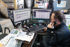 Dealership employee closing a sale over the phone.
