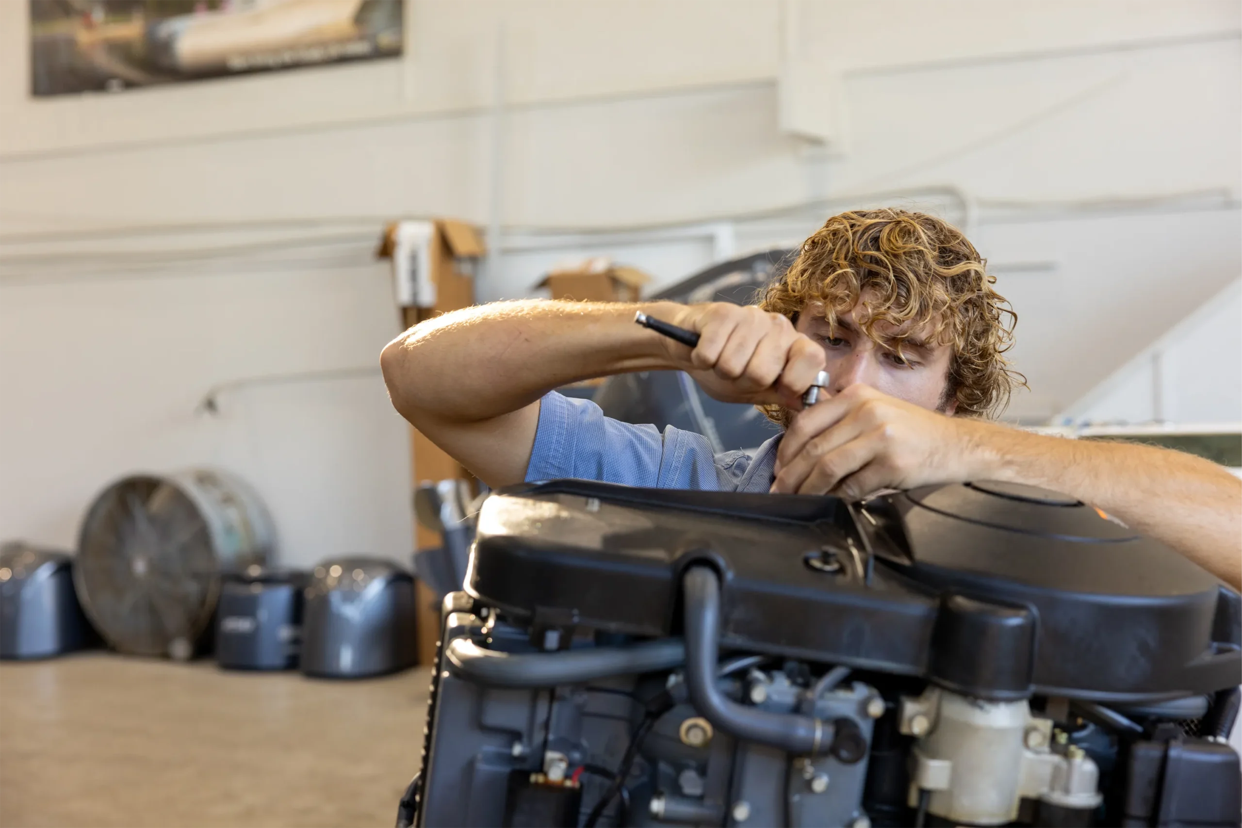 Marine technician working at a service shop