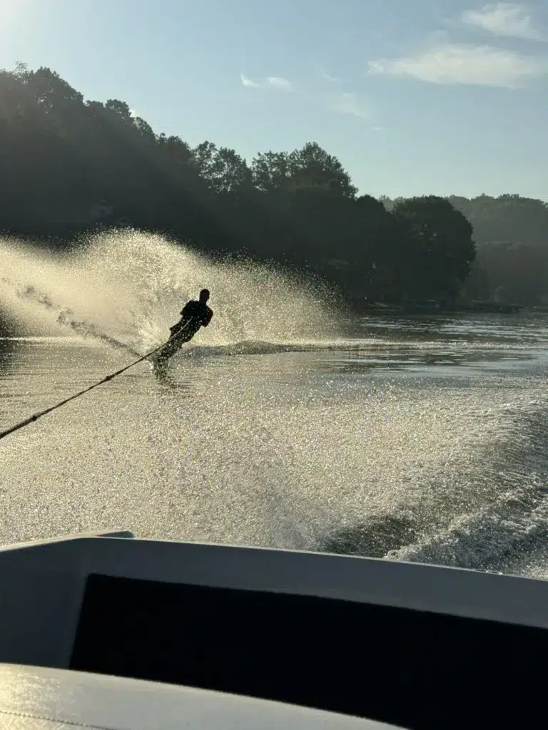 Water skiing on a lake demonstrating safe boating practices and boating access education