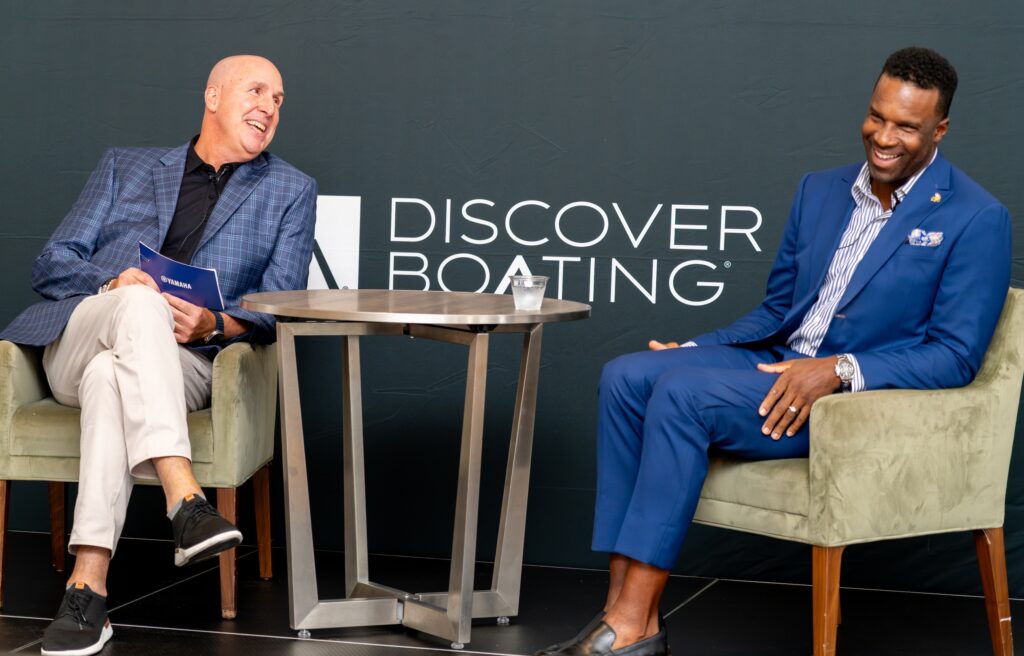Two business men talking on stage at event