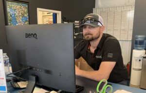 employee at Service Department desk
